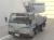 Автовышка Isuzu Elf N Series VI поколение кузов NKR85AN класс автогидроподъёмник Tadano AT-100TT гв 2018 высота подъема люльки 10.5 м пробег 40 т.км серебристый